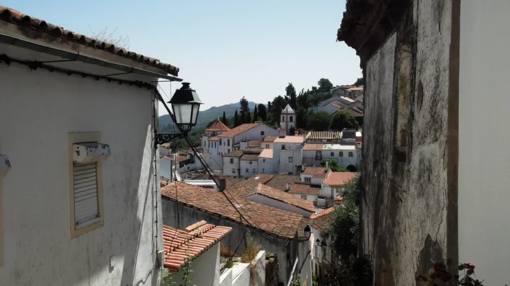 Narrow street and rooftops in Castelo de Vide’s Jewish Quarter.